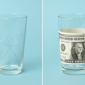 Stack of money covering cracks in a surface, symbolizing how profits can hide structural weaknesses in a business.